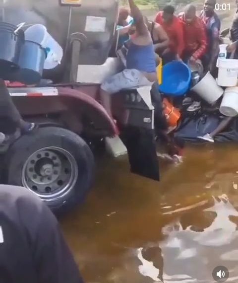 VIDEO: What the hell is this? See risk people take in getting fuel from a fallen tanker
