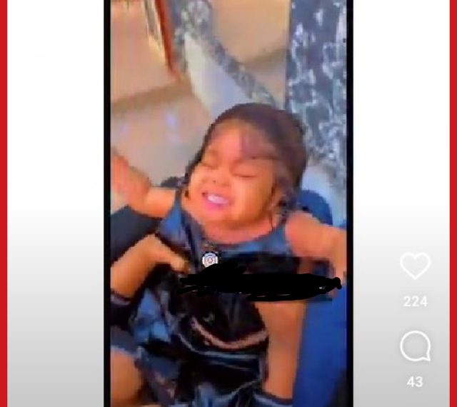 Mother under fire for using heavy frontal on a baby (watch video)