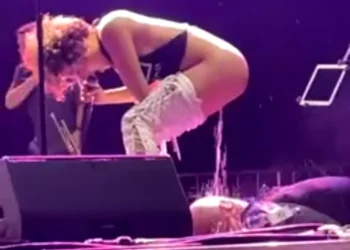 Watch the video of a female artist urinating on a man’s face on stage