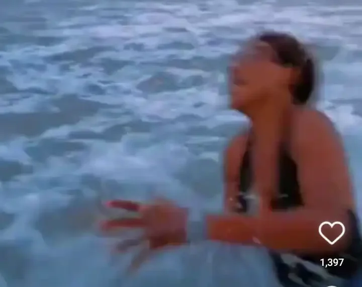 Lady almost got drowned by water waves while posing for a photograph (Watch video) 1 Lady almost got drowned by water waves while posing for a photograph  (Watch video)