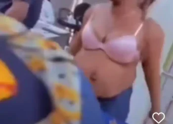 Watch moment woman pulls clothes in a bank hall over bank frustration (video)