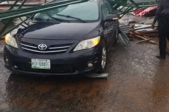 Car Damaged By Rainstorm At Unity Road Ilorin When A Political Sign Post Fell On It, Newsblenda