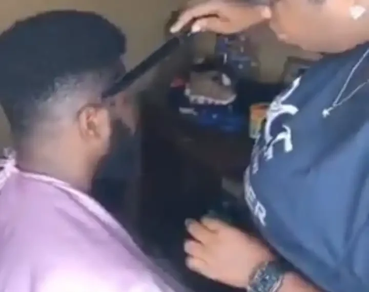 Guys can you allow this? Lady shows off barbing skills using knife and cutlass (Video) 1 Guys can you allow this? Lady shows off barbing skills using knife and cutlass (Video)