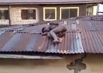 Confusion As Residents Spots A ‘Witch’ Sleeping On A Roof In Benin [VIDEO]