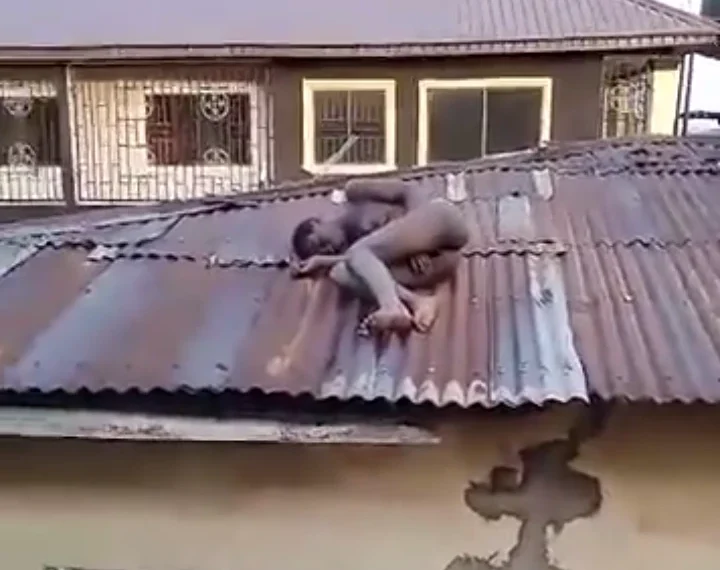 Confusion As Residents Spots A ‘Witch’ Sleeping On A Roof In Benin [VIDEO]