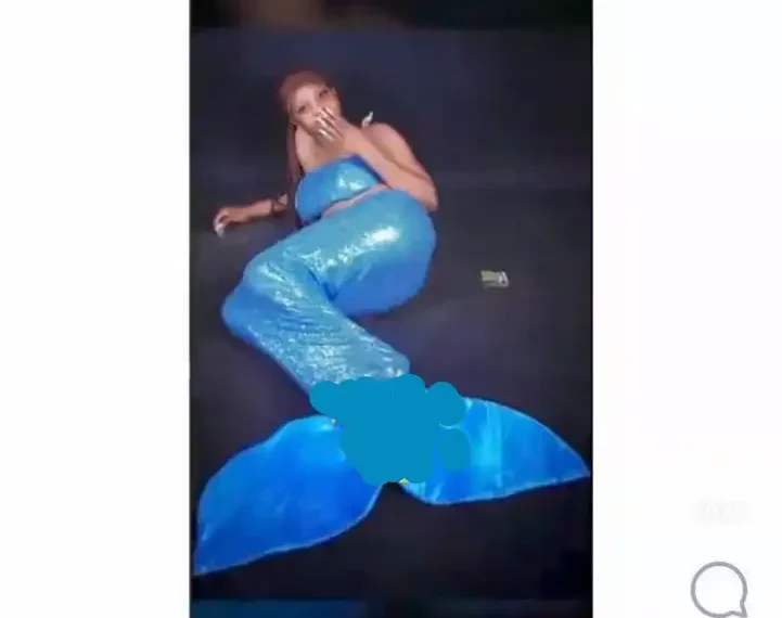 Osun lady goes viral for using a mermaid costume for birthday shoot (video) 1 Osun lady goes viral for using a mermaid costume for birthday shoot (video)