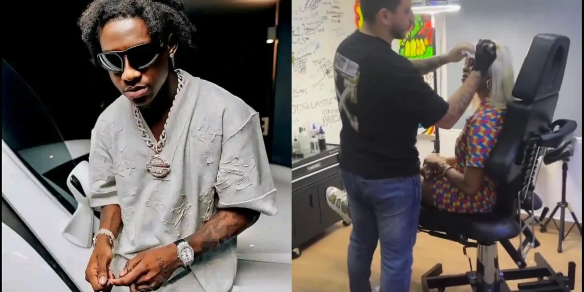 Lady expresses joy after tattooing Shallipopi on her forehead