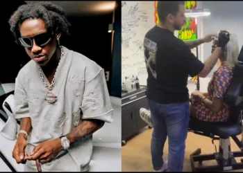 Lady expresses joy after tattooing Shallipopi on her forehead