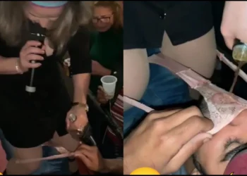 Female artist serves a man drink from her used underwear on stage [VIDEO]
