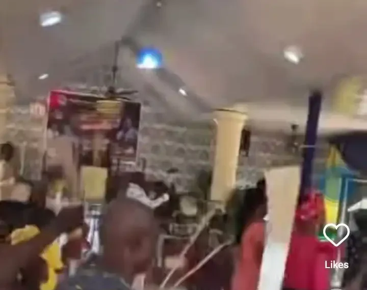 Dramatic moment members carry machetes during prayer in church (video)