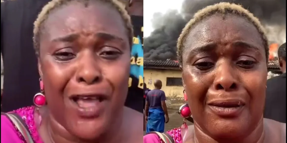 Single mom breaks down in tears as angry mob set her goods on fire in Wuse market 1 Single mom breaks down in tears as angry mob set her goods on fire in Wuse market
