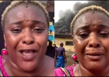 Single mom breaks down in tears as angry mob set her goods on fire in Wuse market