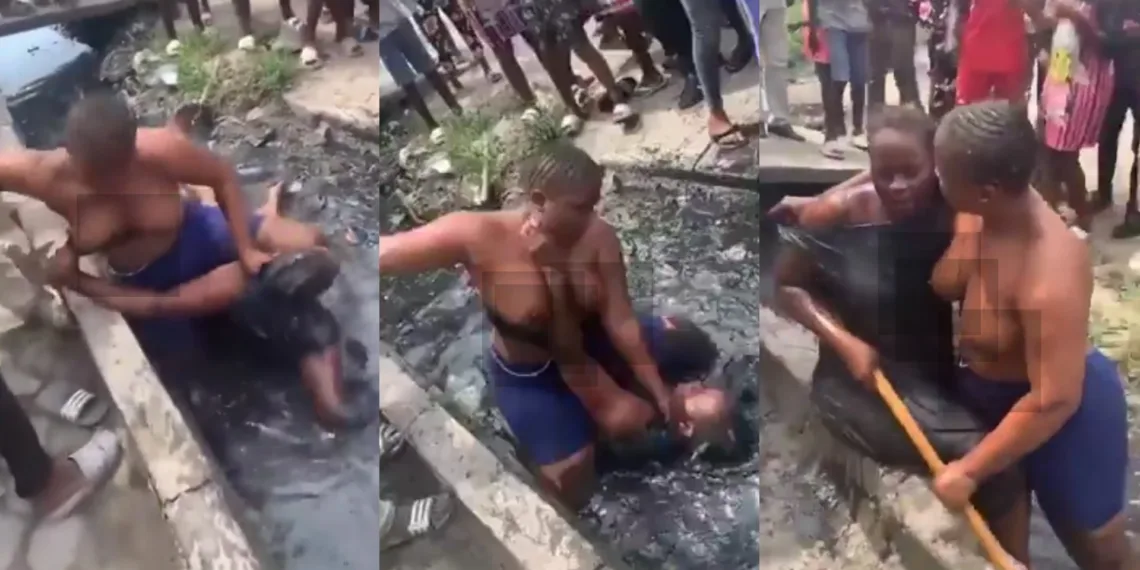 VIDEO: Two ladies nak£d themselves in Lagos dirty gutter over a man 1 VIDEO: Two ladies nak£d themselves in Lagos dirty gutter over a man