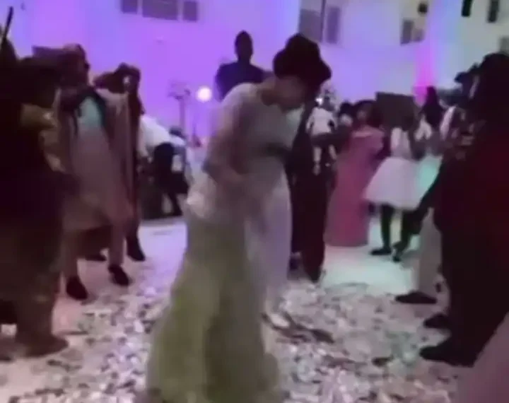 The fear of EFCC: Nigerians perplexed at strange currency sprayed in a wedding party (video) 1 The fear of EFCC: Nigerians perplexed at strange currency sprayed in a wedding party (video)
