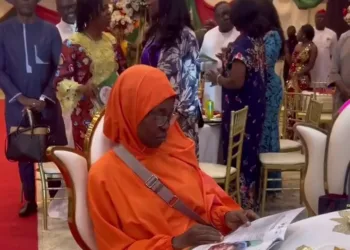 Video of Alisha Yesufu refusing to stand & sing the new national anthem