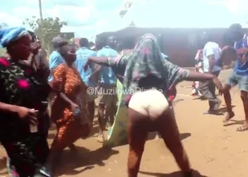 Video of married women pulling their clothes in front of children