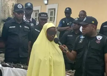 Woman Arrested with AK-47 Hidden in Garri Sack